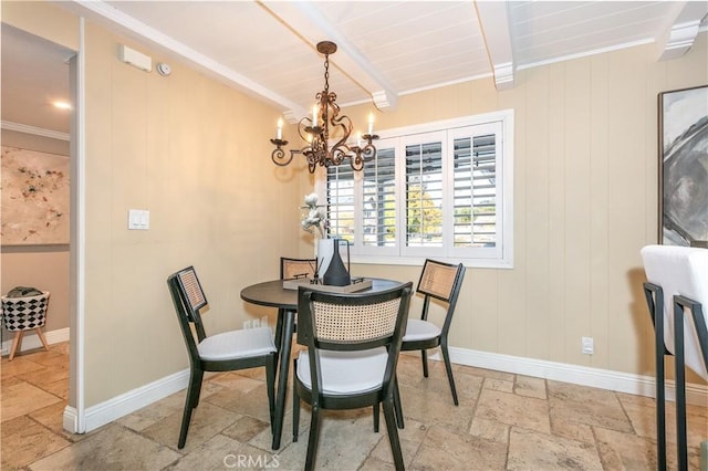 dining space with ornamental molding, an inviting chandelier, and beam ceiling