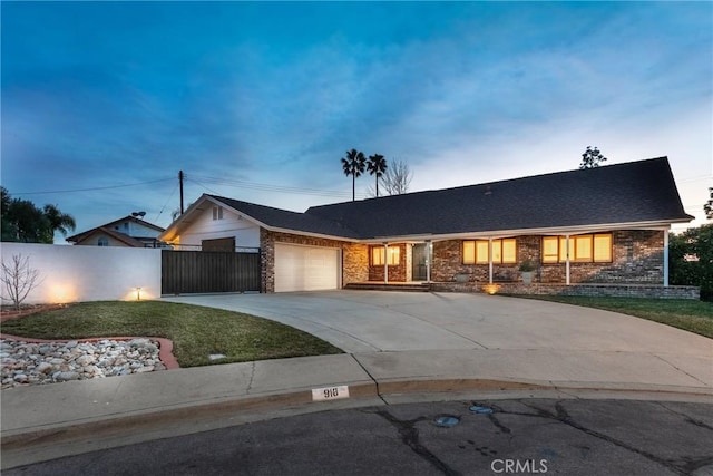 ranch-style home featuring a garage