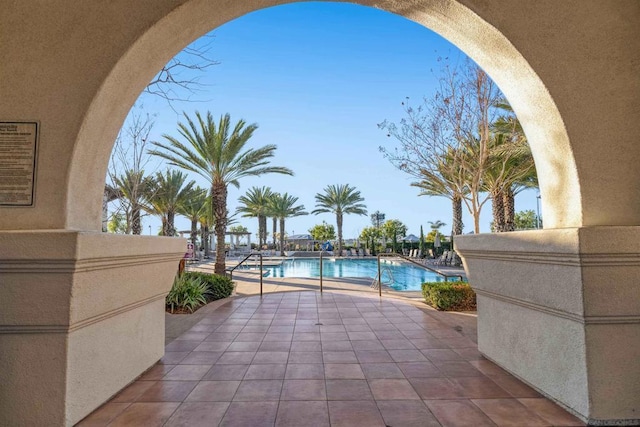 view of swimming pool with a patio