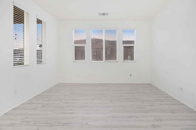 spare room featuring light wood-type flooring