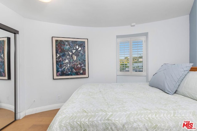 bedroom featuring hardwood / wood-style floors