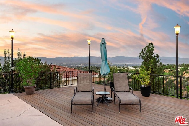 deck at dusk with a mountain view