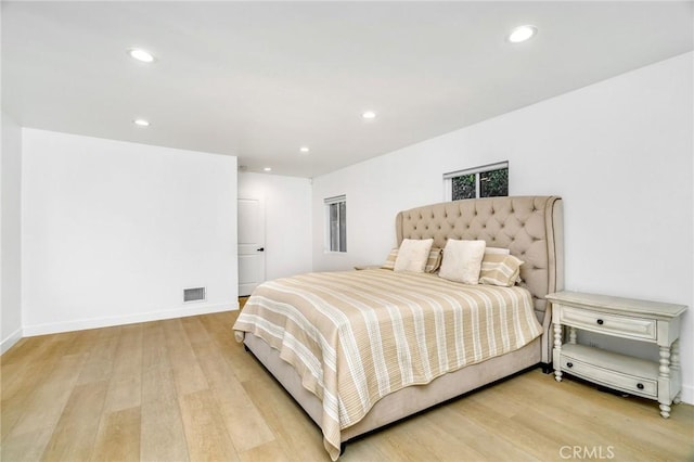 bedroom with light hardwood / wood-style flooring