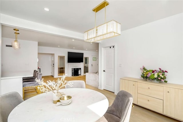 dining space featuring light hardwood / wood-style flooring