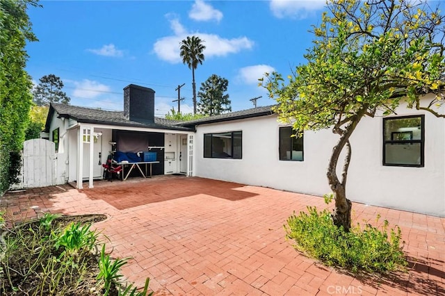 rear view of house with a patio area