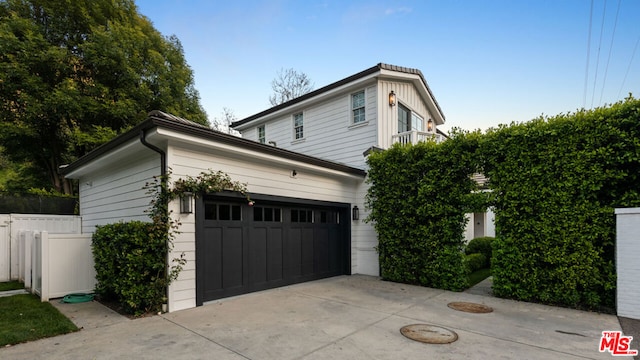 view of side of home with a garage