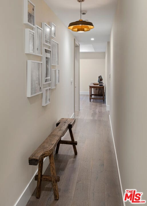 corridor with wood-type flooring