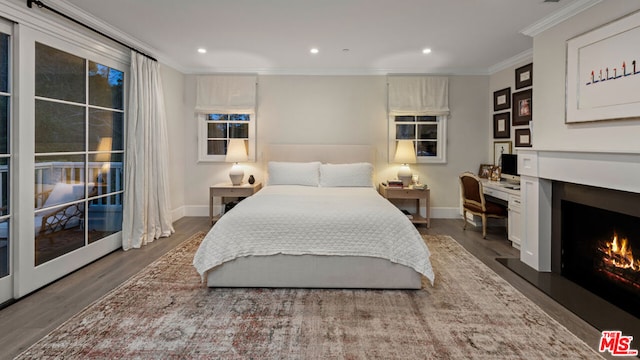 bedroom featuring dark wood-type flooring and ornamental molding