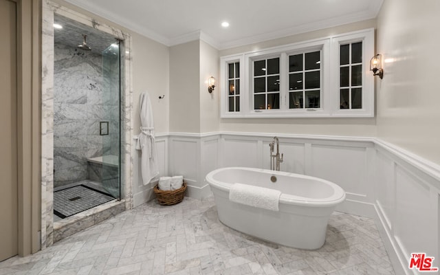 bathroom with ornamental molding and plus walk in shower