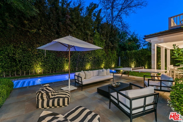 view of patio / terrace with a balcony and outdoor lounge area