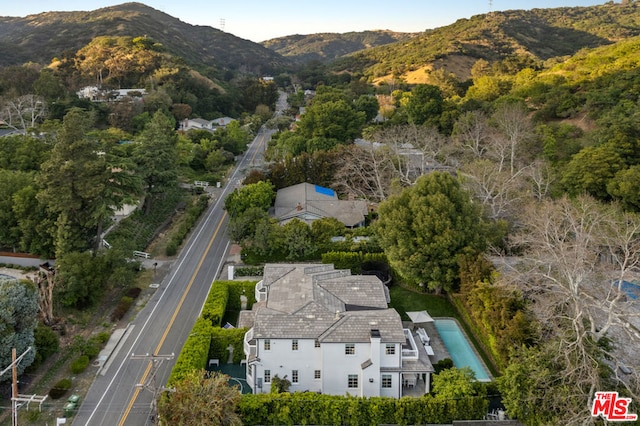 birds eye view of property with a mountain view