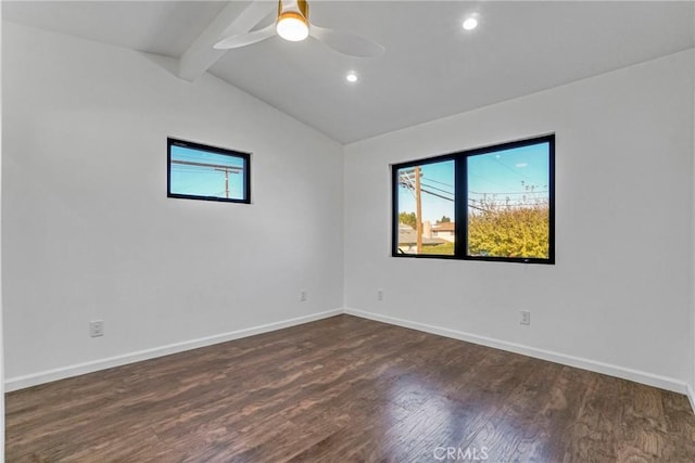 unfurnished room featuring dark hardwood / wood-style flooring, ceiling fan, lofted ceiling with beams, and a healthy amount of sunlight