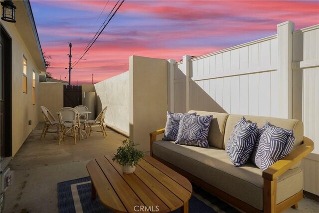 patio terrace at dusk with outdoor lounge area