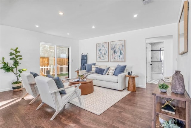 living room with dark hardwood / wood-style flooring