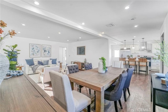 dining space featuring hardwood / wood-style floors