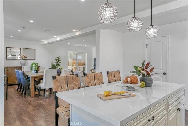 dining space with hardwood / wood-style flooring