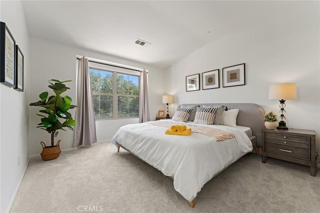 carpeted bedroom featuring vaulted ceiling