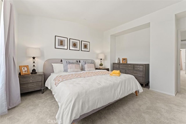 carpeted bedroom with vaulted ceiling