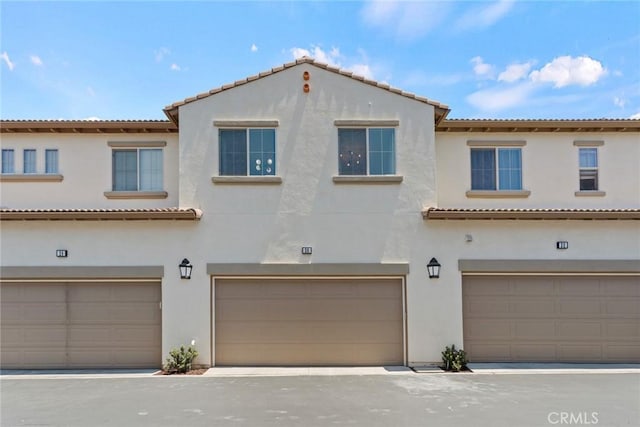 mediterranean / spanish-style house featuring a garage