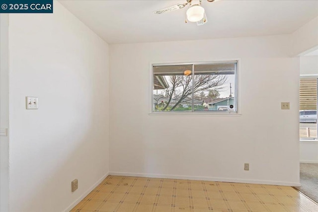 unfurnished room with ceiling fan