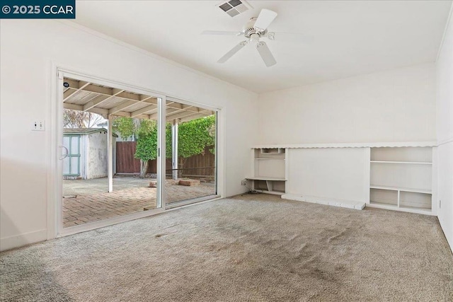 unfurnished living room featuring ceiling fan and carpet