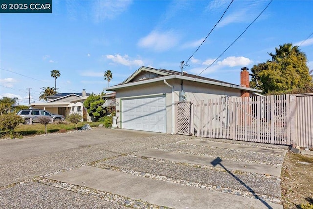 view of side of home with a garage