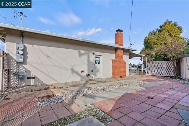 back of house featuring a patio