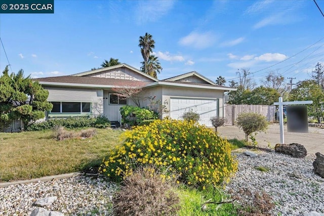 ranch-style house with a garage and a front yard