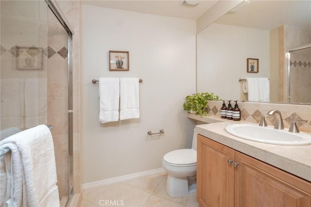 bathroom featuring vanity, toilet, an enclosed shower, and tile patterned flooring