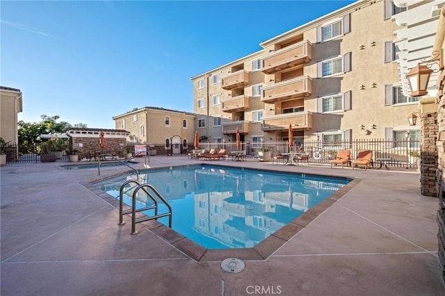 view of swimming pool with a patio area