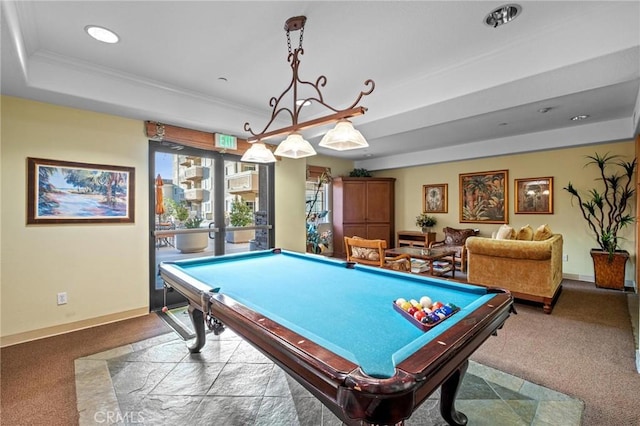 playroom featuring billiards, ornamental molding, a raised ceiling, and carpet floors