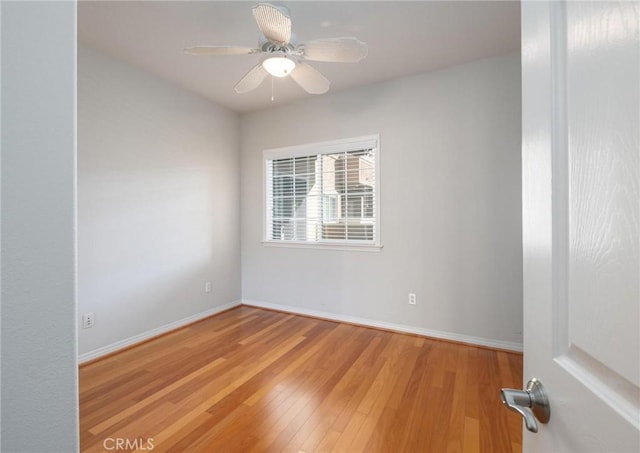 unfurnished room with ceiling fan and light hardwood / wood-style flooring