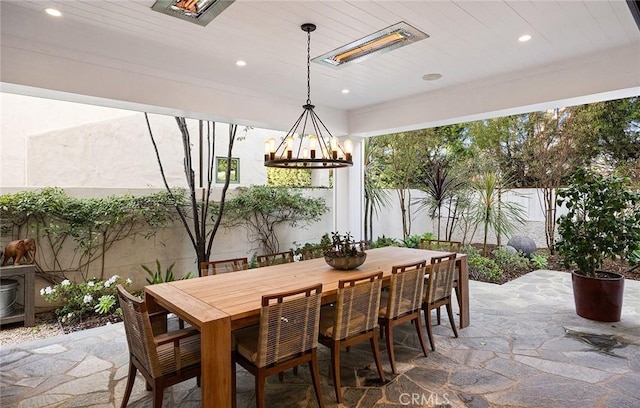 dining room featuring plenty of natural light, stone tile floors, and recessed lighting