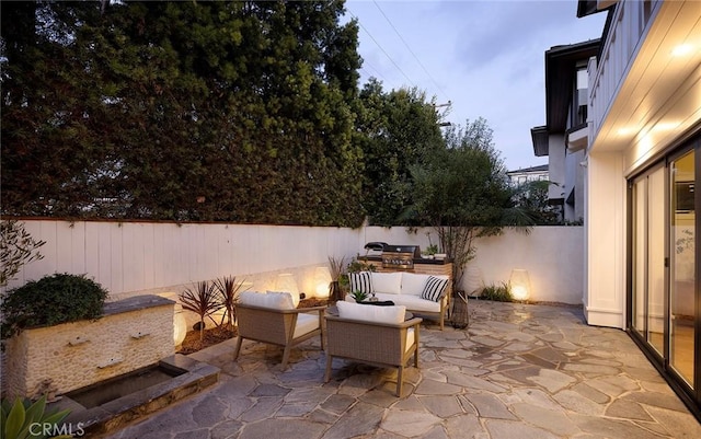 view of patio / terrace featuring a fenced backyard and an outdoor living space