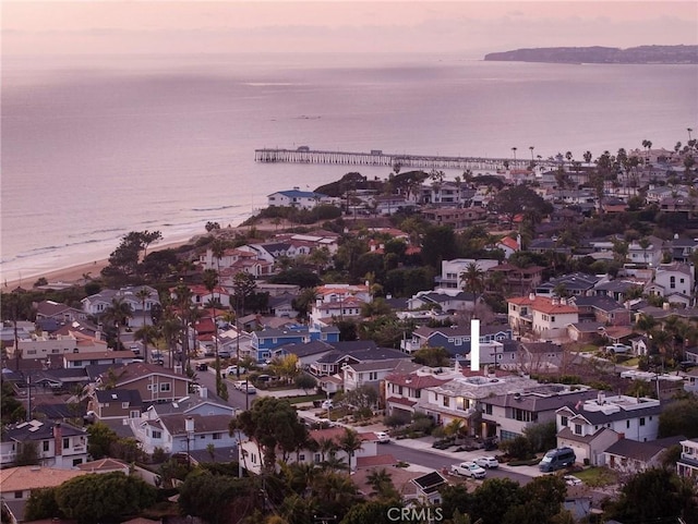 aerial view at dusk with a water view