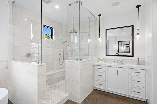 bathroom featuring vanity, tiled shower, tile walls, and crown molding