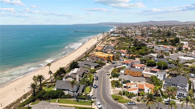 bird's eye view featuring a beach view and a water view