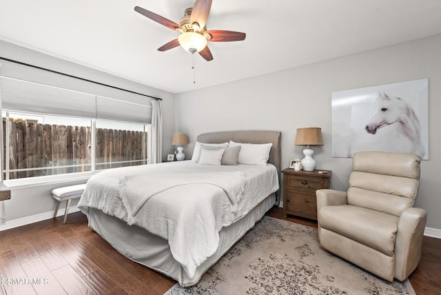 bedroom featuring dark hardwood / wood-style flooring and ceiling fan