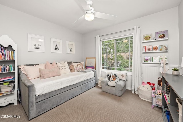 bedroom featuring light carpet and ceiling fan