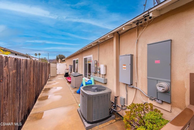 view of home's exterior featuring a patio area and central air condition unit