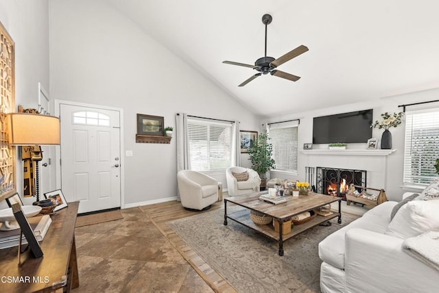 living room with high vaulted ceiling and ceiling fan