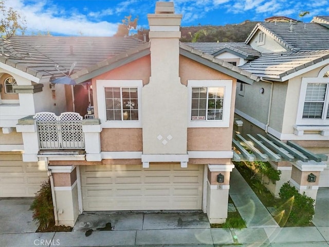 back of property with a garage