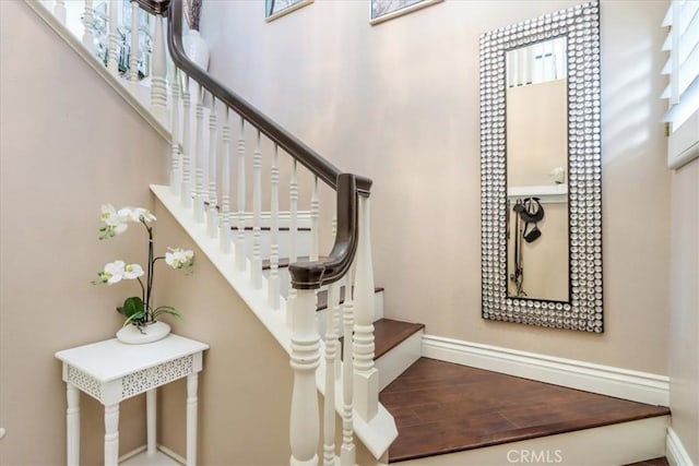 stairs featuring wood-type flooring