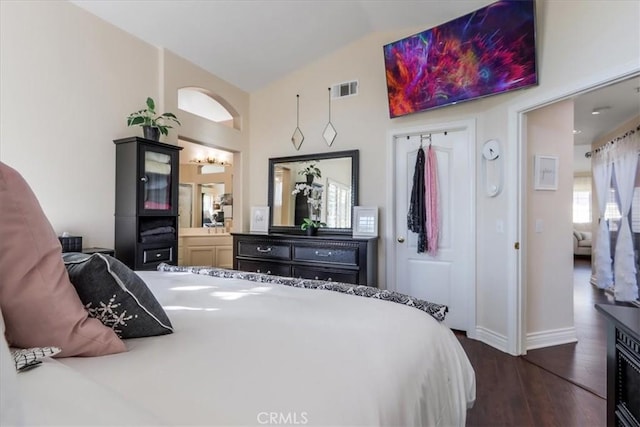 bedroom with lofted ceiling and dark wood-type flooring