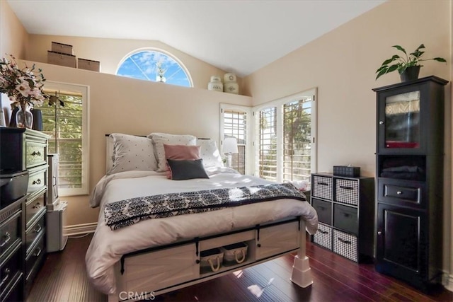 bedroom featuring dark hardwood / wood-style flooring and vaulted ceiling