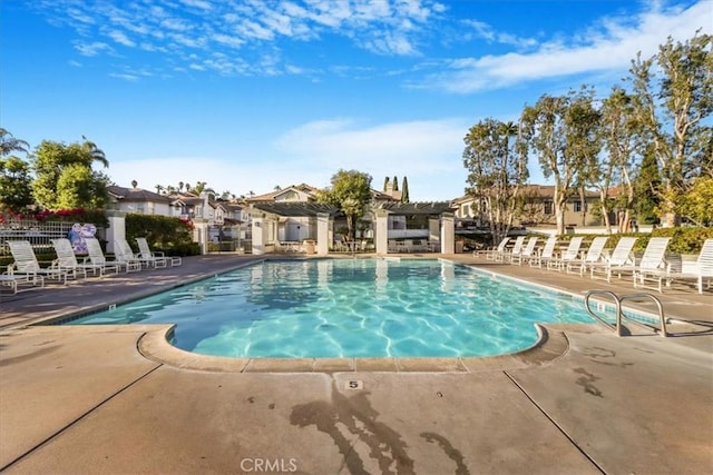 view of pool with a patio area and a pergola