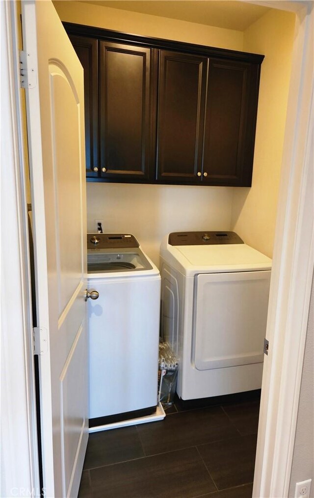 laundry area featuring cabinets and washer and dryer