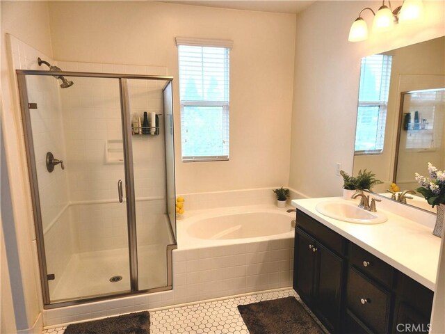 bathroom featuring vanity, tile patterned flooring, and independent shower and bath