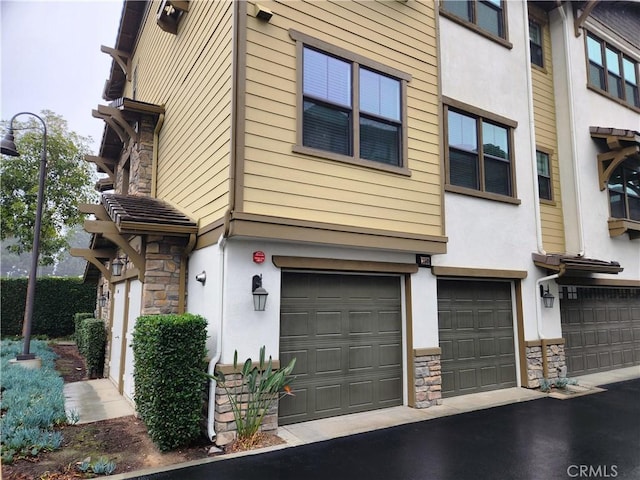 view of side of property with a garage