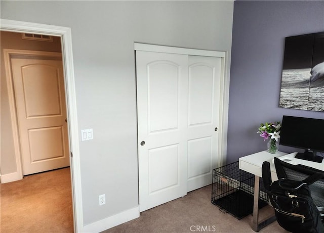 home office with light colored carpet